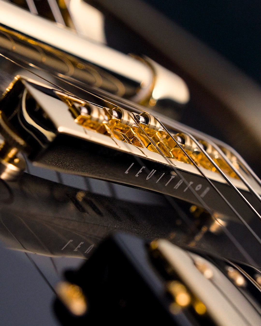 Roller-bridge for guitars in gold