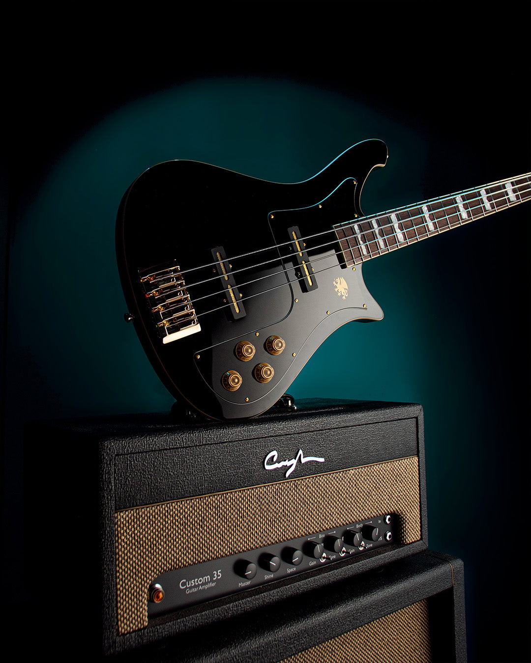 Electric Nidhogg bass guitar on an amplifier with a dark background
